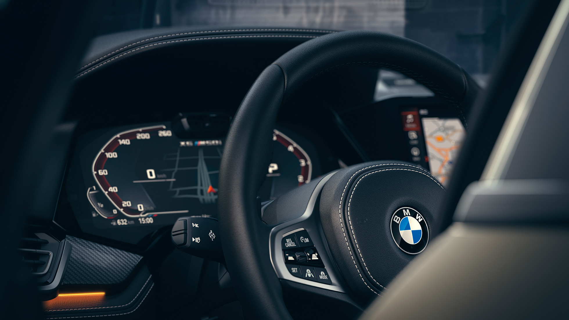 BMW-avustinjärjestelmät. Lähikuva BMW:n sisätilan mittaristosta.